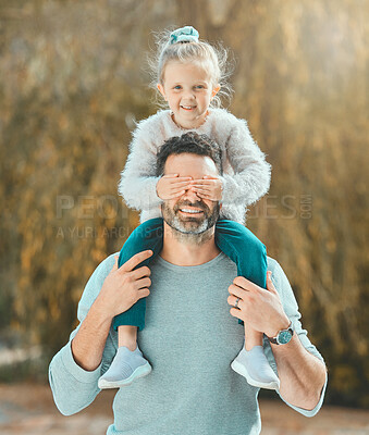 Buy stock photo Shot of a father spending time outdoors with his young daughter