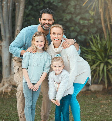 Buy stock photo Shot of a family standing together in a yard