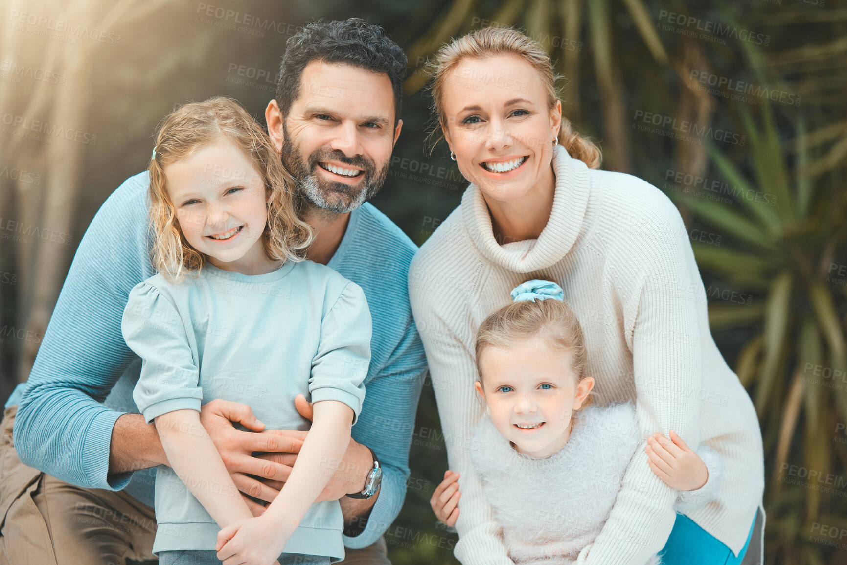 Buy stock photo Shot of a family standing together in a yard