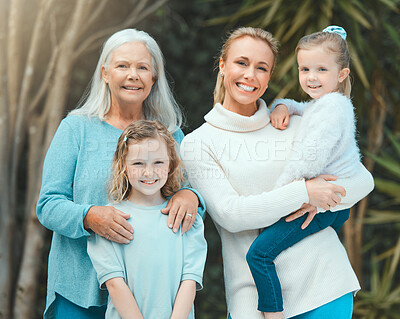 Buy stock photo Shot of a two young girls posing outside with their mother and grandmother