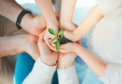 Buy stock photo Shot of a  unrecognizable family holding plants growing out of soil