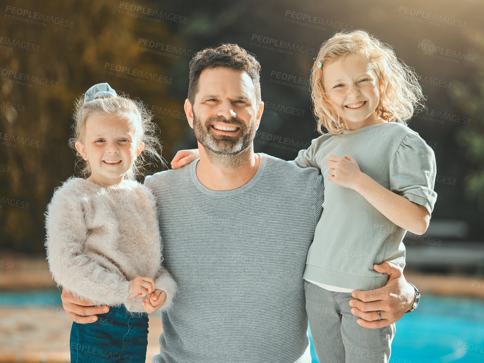 Buy stock photo Family, outdoor portrait and smile for love, support children and backyard of home. Father, girls and relax together for bonding by pool, Switzerland and happiness in relationship with daughters