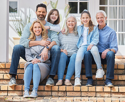 Buy stock photo Full length shot of a family sitting outside together and bonding