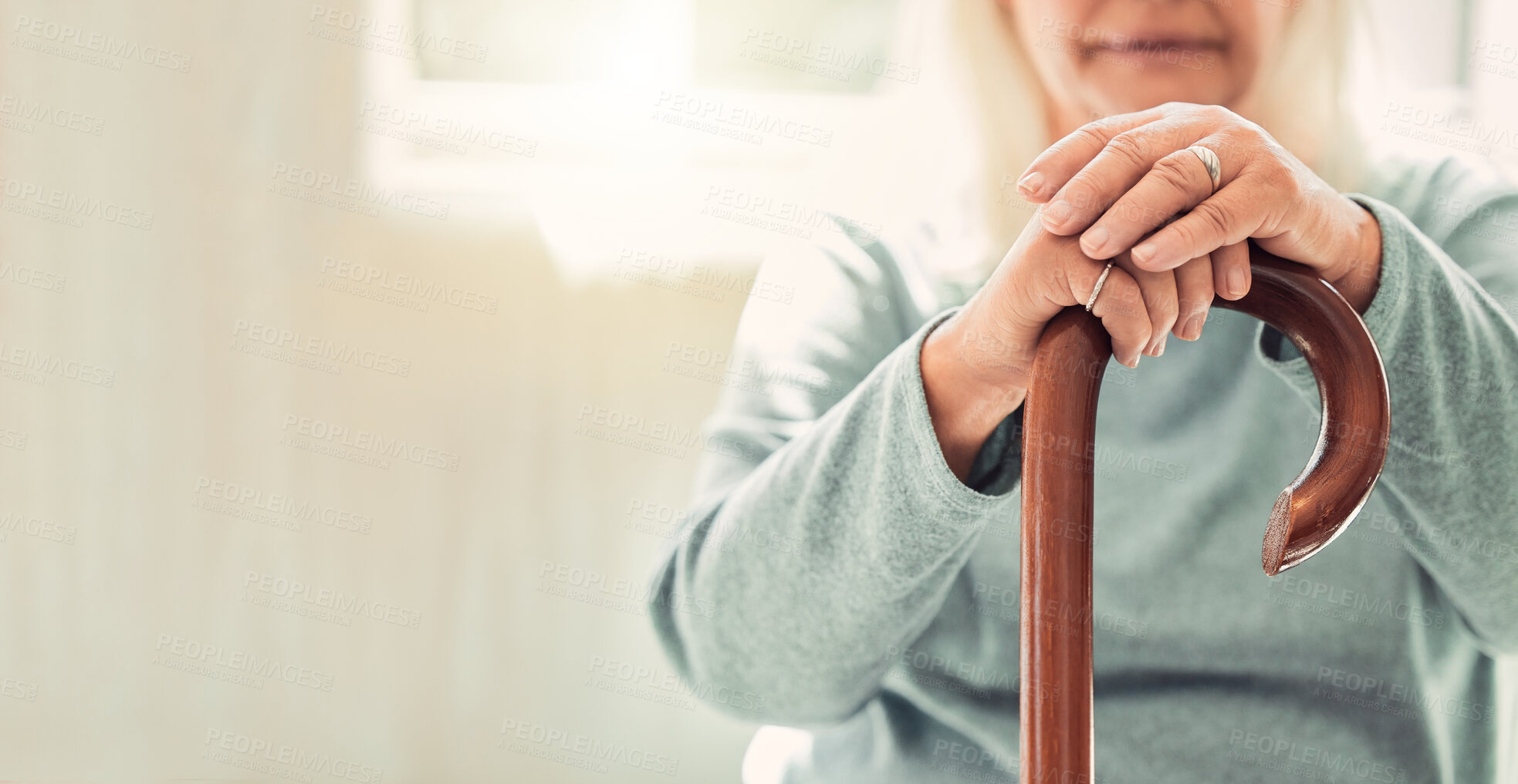 Buy stock photo Relax, cane and hands of elderly woman on sofa with memory, mockup and support in nursing home. Senior care, health and wellness for old person with disability, walking stick and balance with space