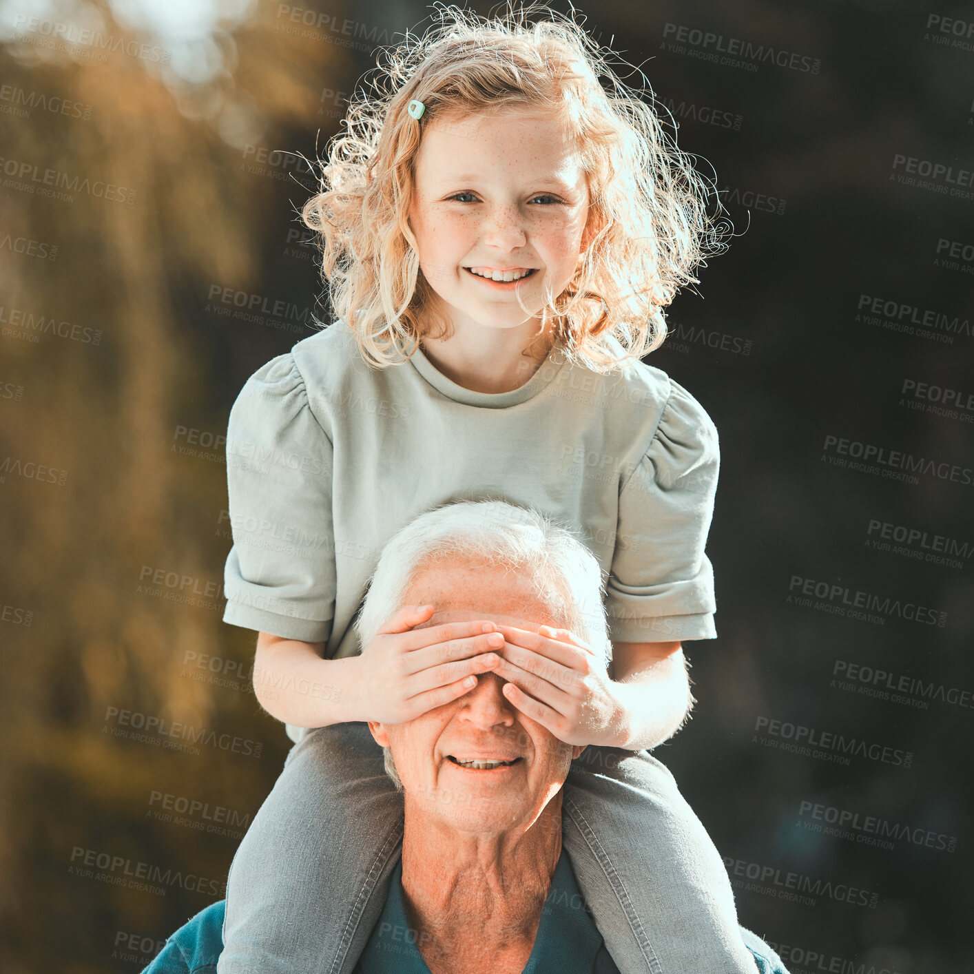 Buy stock photo Portrait, peekaboo and grandpa with child in park for bonding, laughing or funny joke with piggyback. Happy family, cover eyes or grandfather with girl in nature for playful relationship in Australia