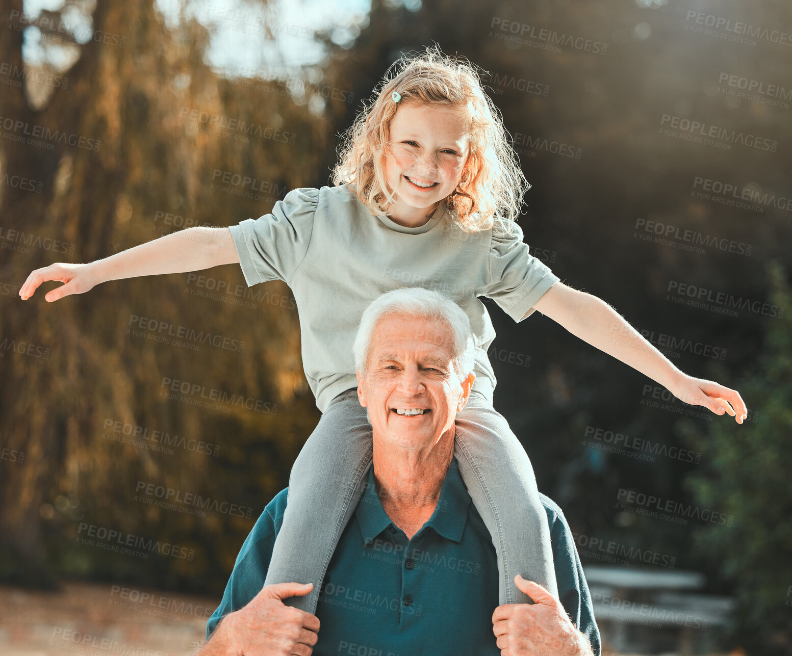 Buy stock photo Portrait, shoulders and grandfather in park, girl and bonding together with happiness, break and fun. Face, smile and senior man carrying kid, playing and childhood with love, family and nature