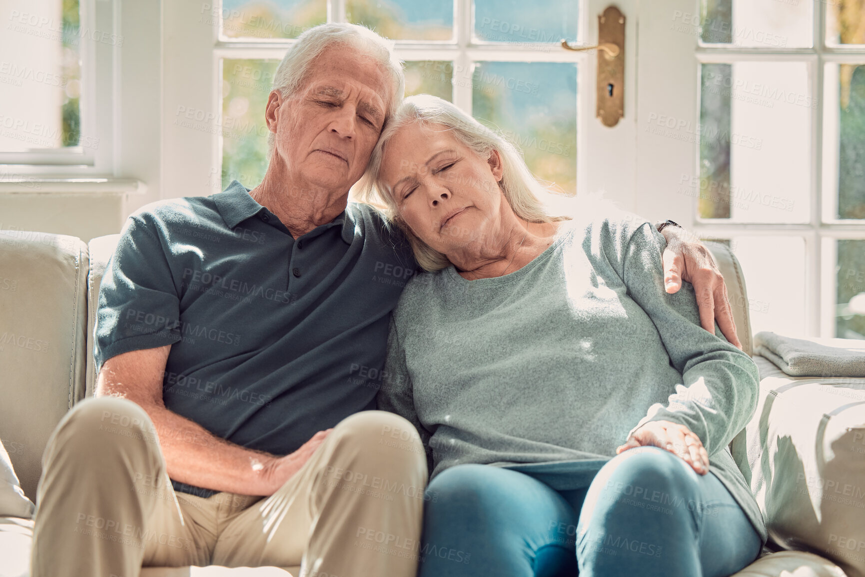 Buy stock photo Love, relax and elderly couple hug in home, living room and bonding or sleeping together with support. Retirement, holiday and senior man with mature woman for trust, peace or care in marriage