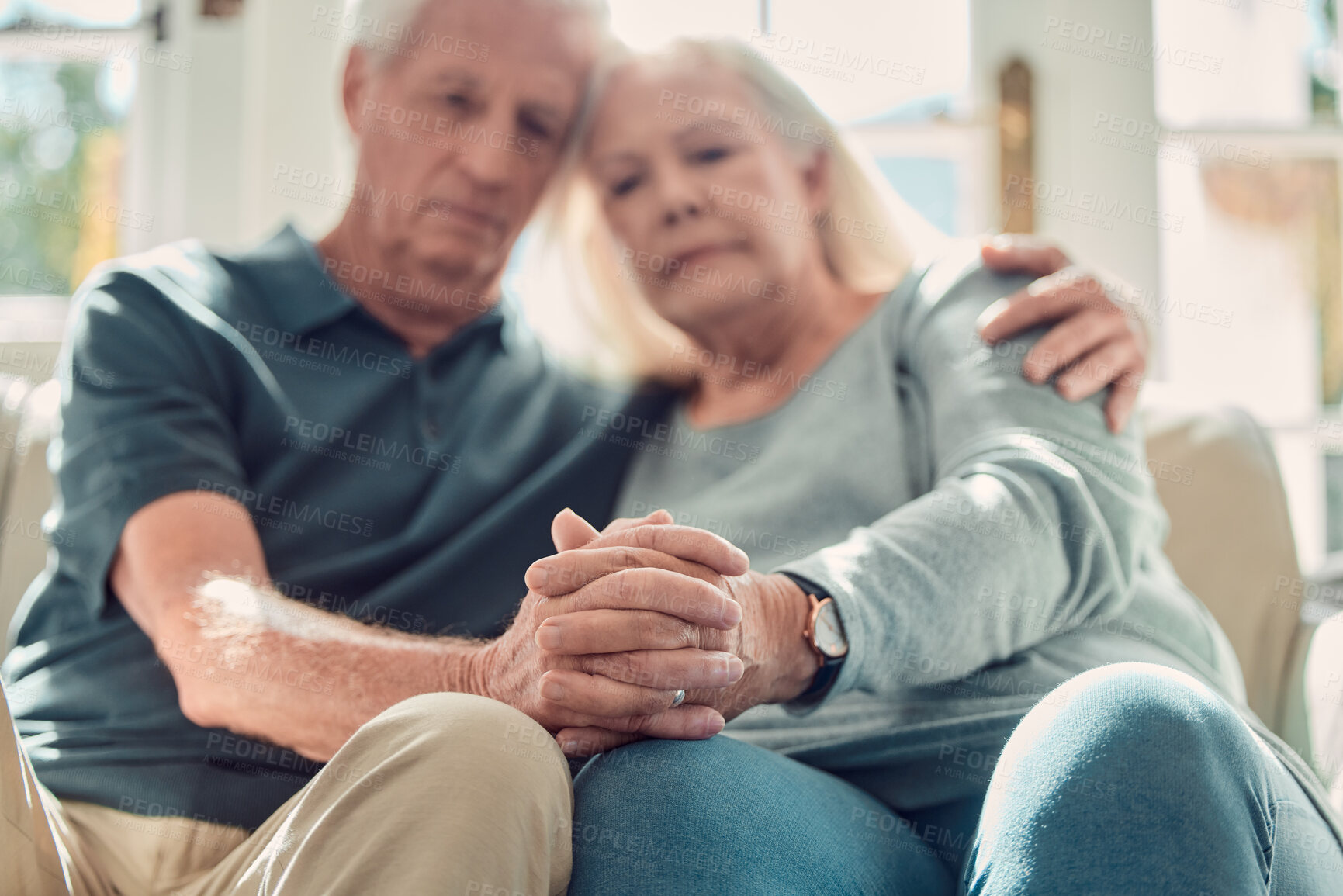 Buy stock photo Senior couple, compassion and support with holding hands, assistance or grief in nursing home or retirement. Elderly people, hug and wellness as empathy in living room for love, care or communication