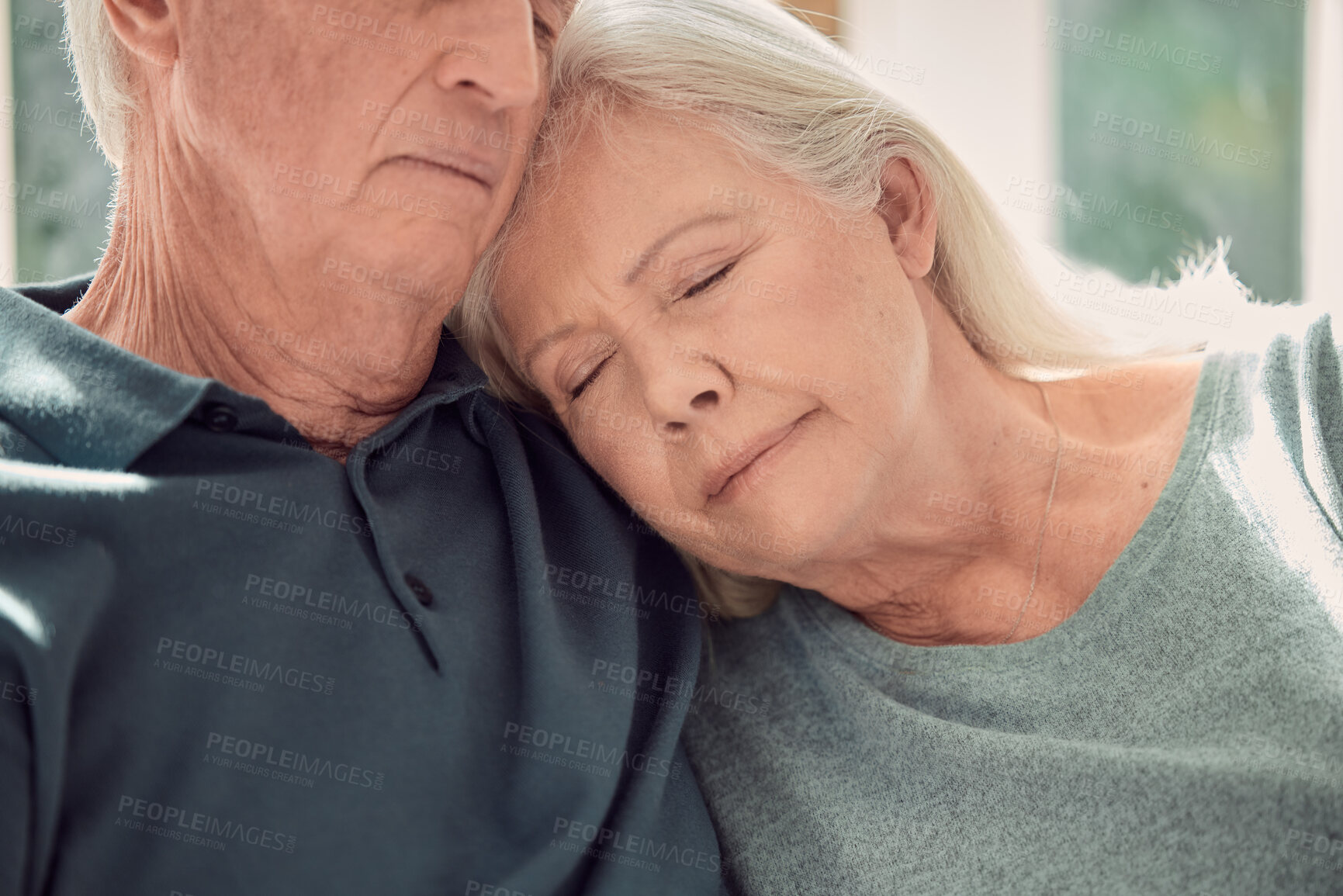 Buy stock photo Love, relax and senior couple hug in home, living room and bonding or sleeping together with support. Retirement, holiday and elderly man with mature woman for trust, peace or care in marriage