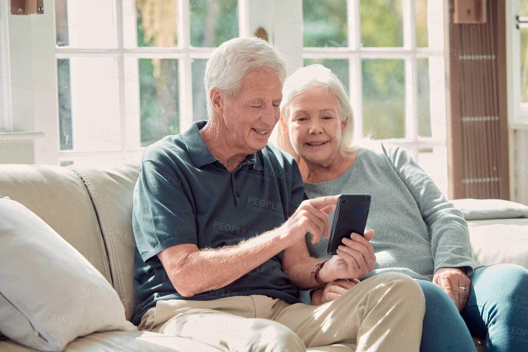 Buy stock photo Senior people, news and social network with mobile phone for scroll on app in retirement home. Elderly couple, technology and happiness for connection in lounge for website internet and communication