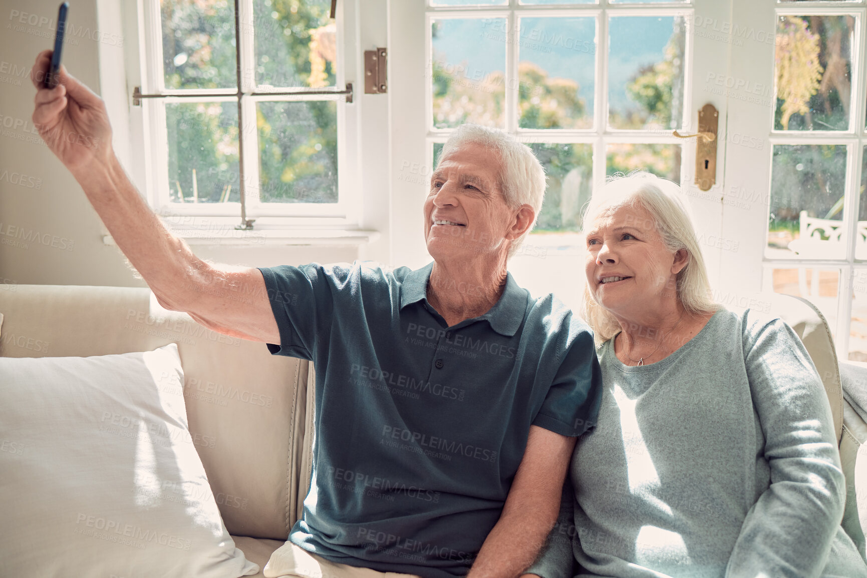 Buy stock photo Smile, senior couple and selfie in home for memory, love and bonding together. Happy man, woman and picture in living room for retirement photo, social media post or healthy relationship with partner