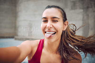 Buy stock photo Outdoor, woman and tongue out for fitness with selfie for social media post, interaction and profile picture in Spain. Female person, portrait and smile or happy outside on workout or exercise break