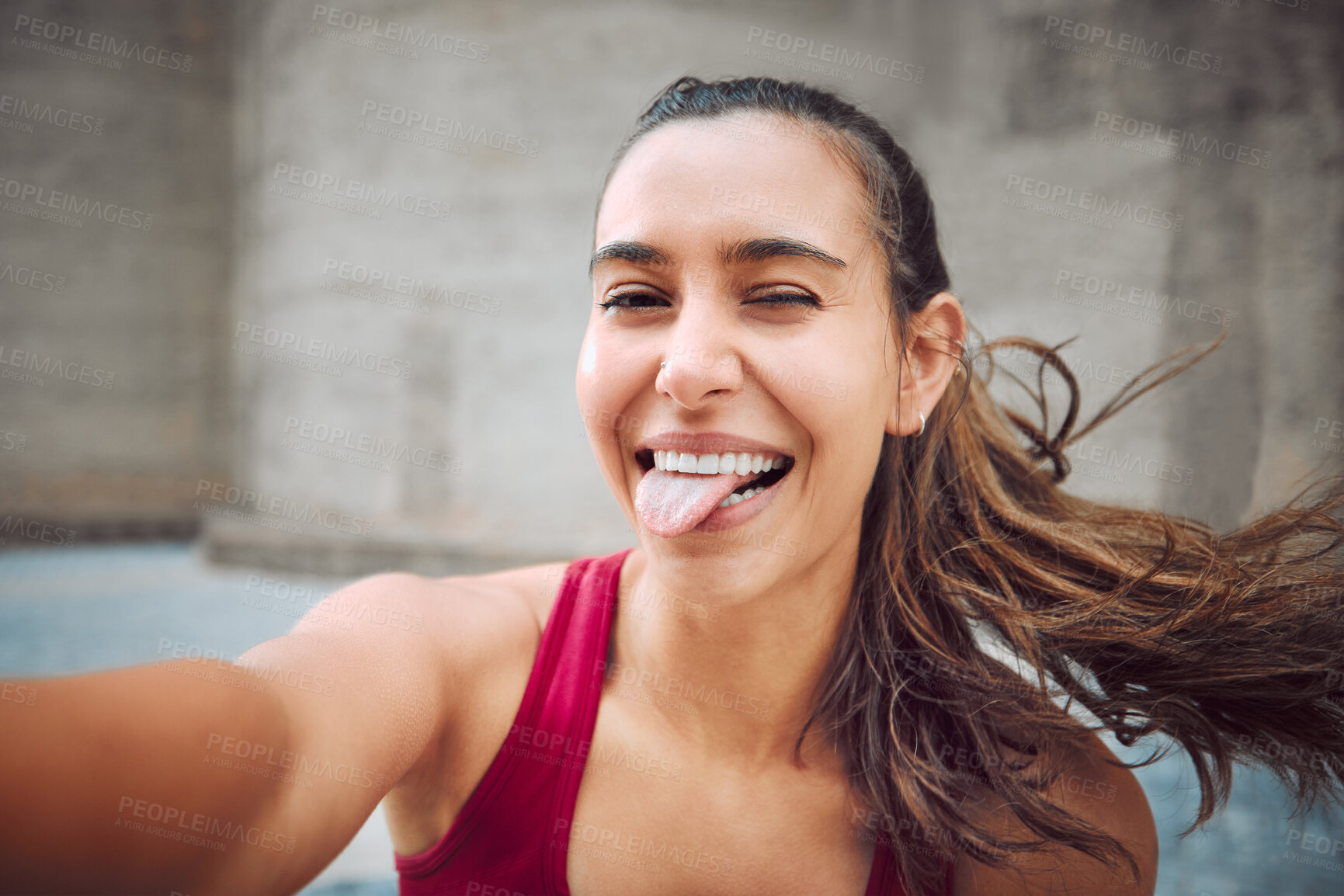 Buy stock photo Outdoor, woman and tongue out for fitness with selfie for social media post, interaction and profile picture in Spain. Female person, portrait and smile or happy outside on workout or exercise break