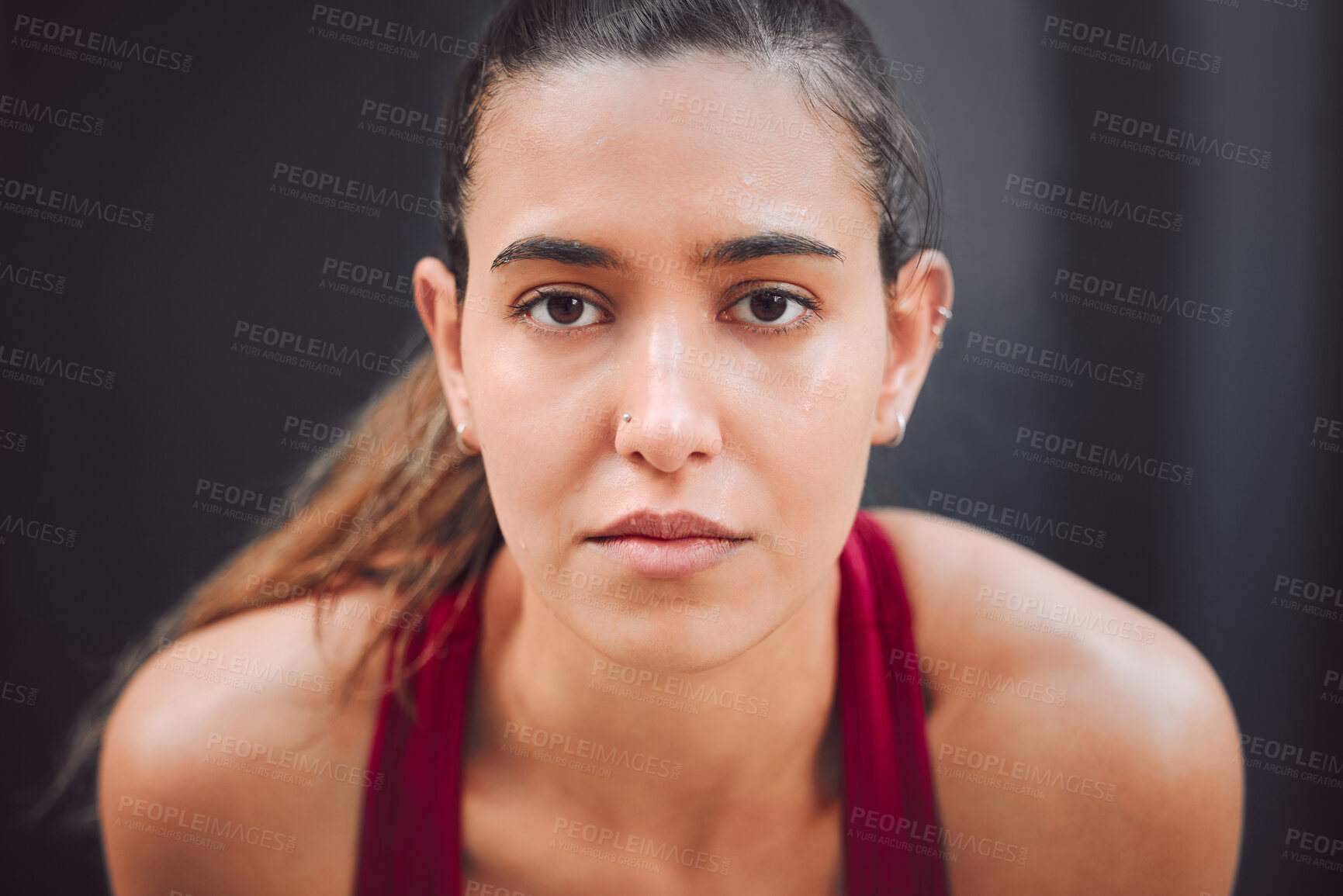 Buy stock photo Outdoor, woman and tired on portrait with running for fitness, health and self care in Spain. Female person, sweat and serious outside on jogging break in sportswear for exercise and workout