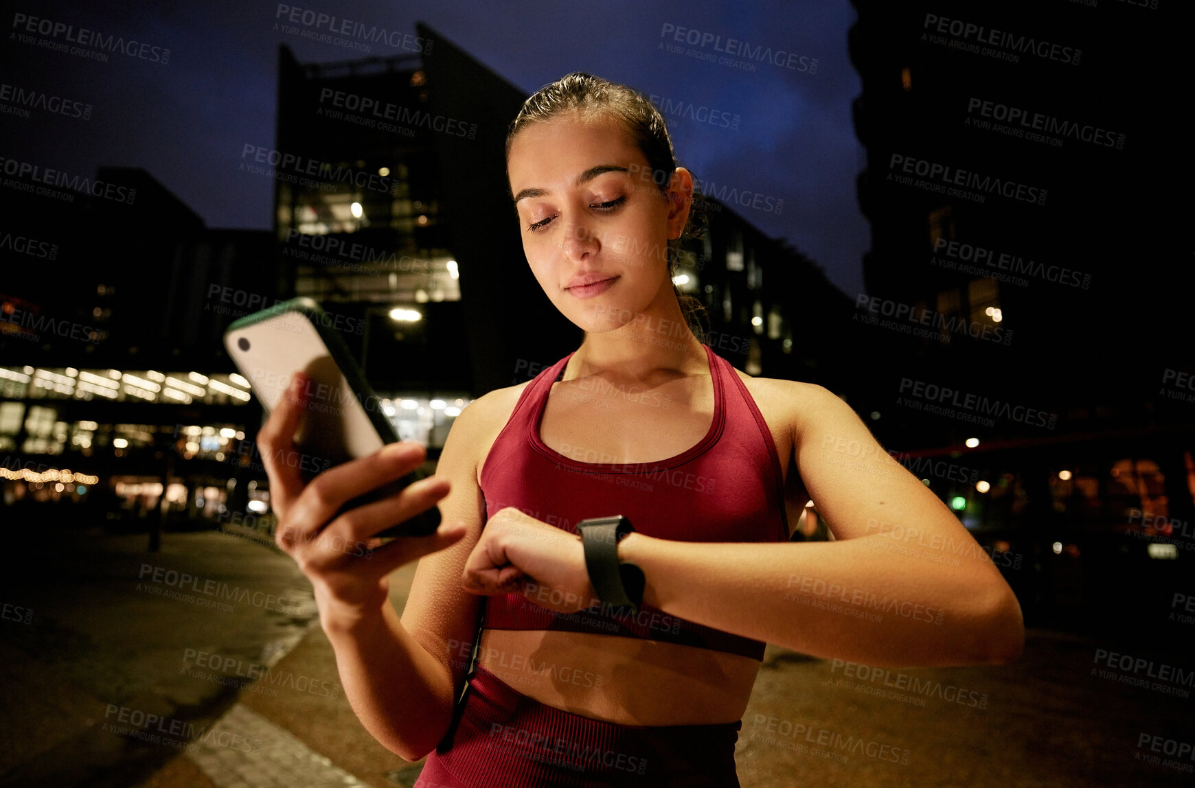 Buy stock photo Fitness, phone and time with woman in city for running, health app and smart watch tracking. Sports, workout and wellness with person at night for marathon practice, training plan or monitor progress