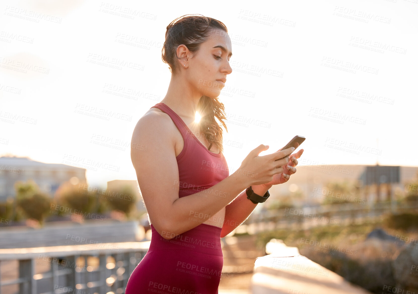 Buy stock photo Fitness, phone and time with woman in city for running, health app and digital tracking. Sports, workout schedule and wellness with person for marathon practice, training plan or monitor progress