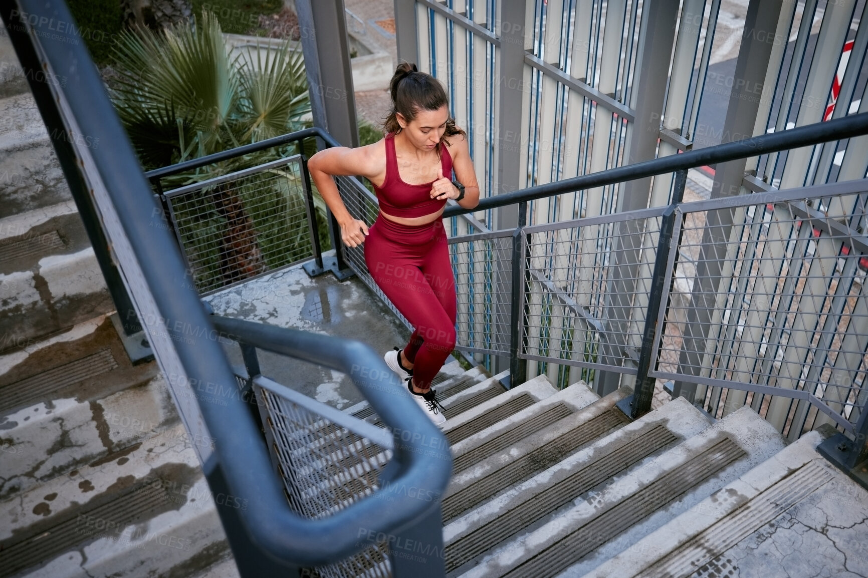 Buy stock photo Shot of a young woman running in the city