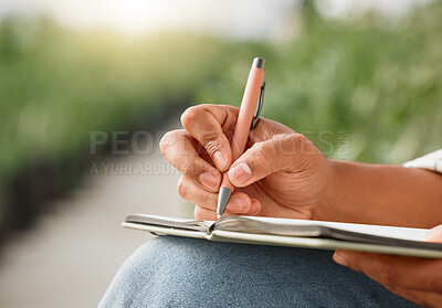 Buy stock photo Closeup shot of an unrecognisable man writing notes while working on a farm