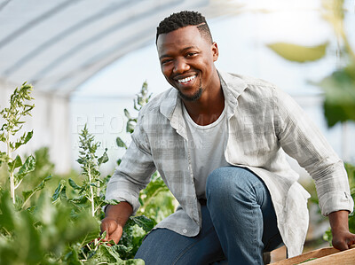 Buy stock photo Portrait of a young man tending to crops on a farm
