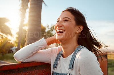 Buy stock photo Shot on a young woman standing on a farm