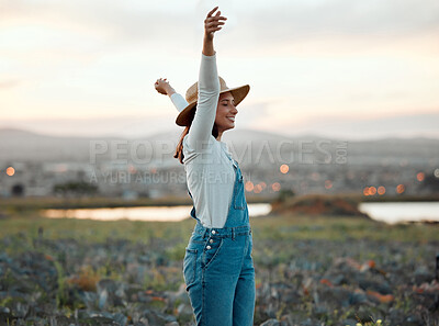 Buy stock photo Shot of a young farmer standing on a open field