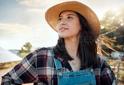 Buy stock photo Shot of a female farmer stand on a farm
