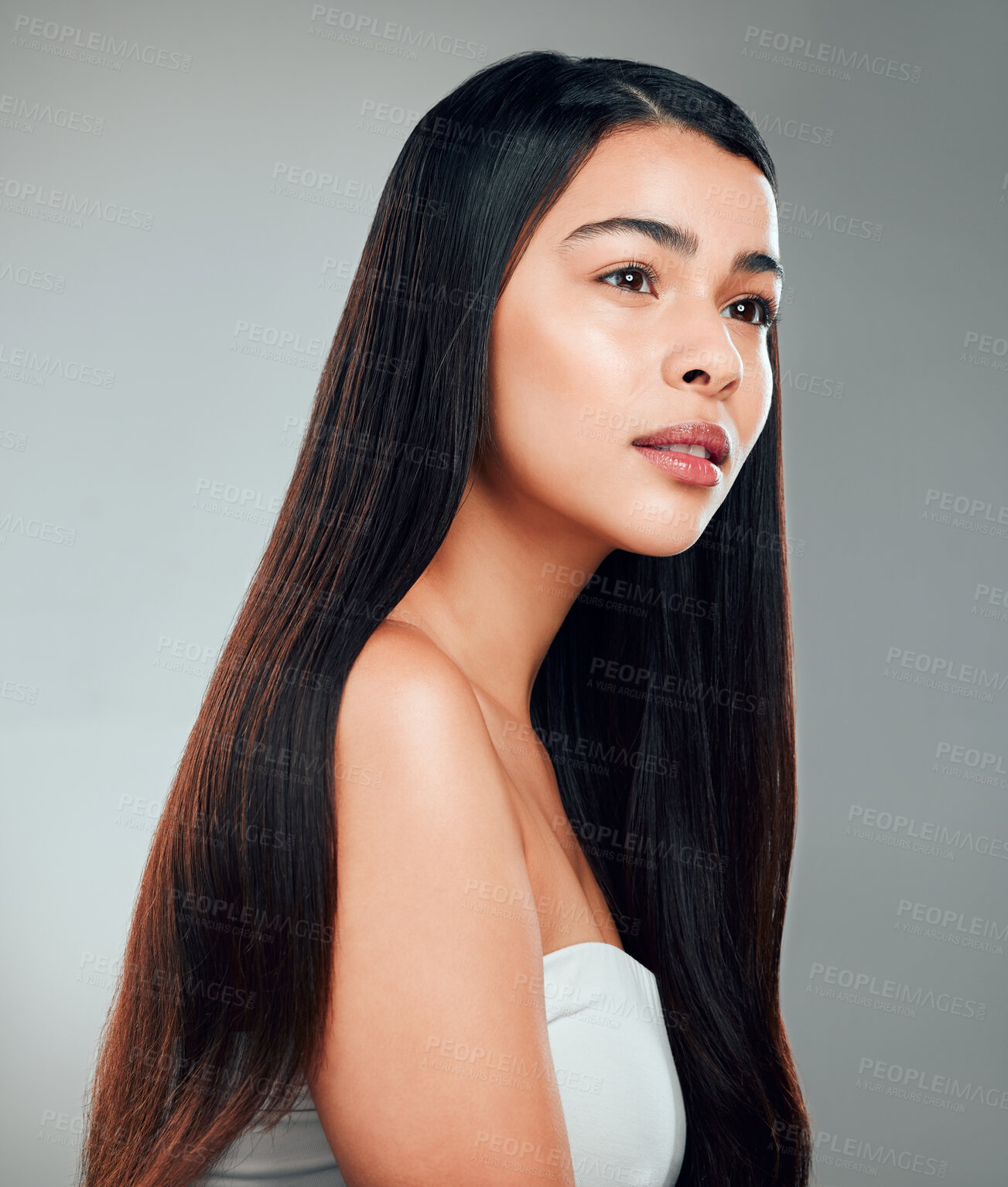 Buy stock photo Studio shot of a beautiful young woman with long brown hair