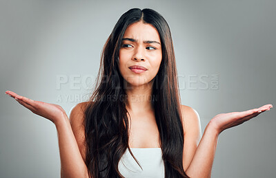 Buy stock photo Studio shot of a beautiful young woman with half curled hair and half straight