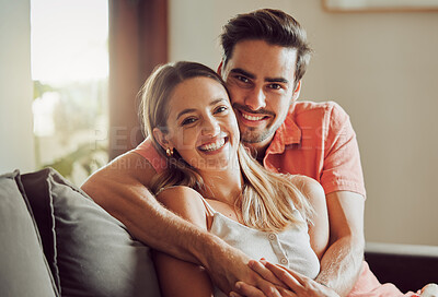 Buy stock photo Sofa, happy and portrait of couple hug in home for bonding, relax together and comfortable on weekend. Living room, apartment and man and woman on couch embrace for love, affection and relationship