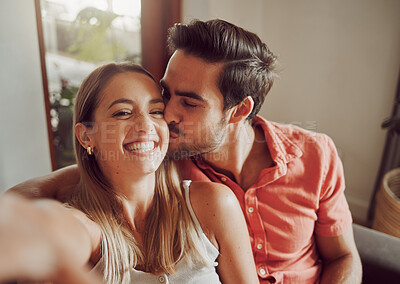 Buy stock photo Selfie, kiss and portrait of couple on sofa in new home for bonding, relax together and love on weekend. Living room, smile and man and woman on couch take photo for memory, social media and post