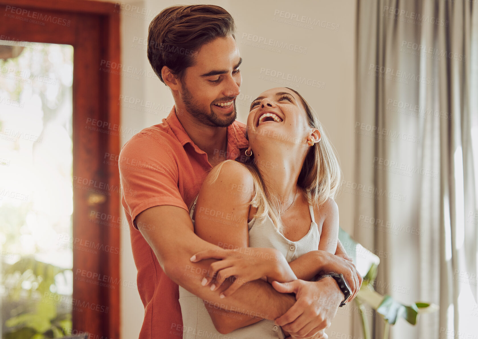 Buy stock photo Shot of a young couple spending time together at home