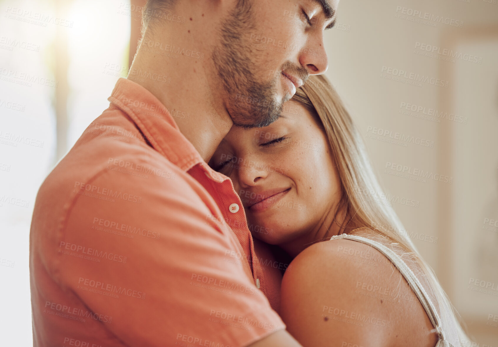 Buy stock photo Happy, love and couple hug in home for bonding, relationship and commitment together in morning. Dating, marriage and man and woman embrace for affection, trust and romantic moment in living room