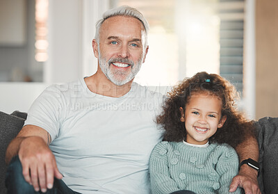 Buy stock photo Shot of a girl sitting at home with her grandfather