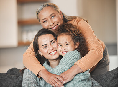 Buy stock photo Portrait of a mature woman boding with her daughter and granddaughter on the sofa at home