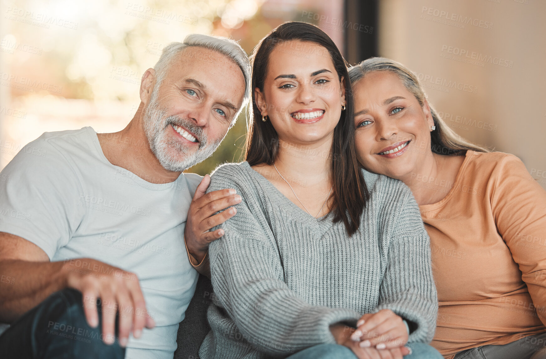 Buy stock photo Shot of a woman sitting on a couch with her parent
