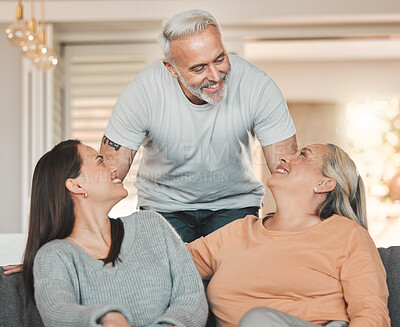 Buy stock photo Shot of a woman sitting on a couch with her parent
