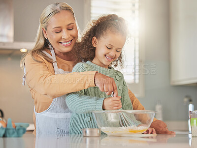 Buy stock photo Bake, kitchen and grandmother with child in home for learning, development or growth. Ingredients, mix and senior woman teaching girl kid to prepare cookies, dessert or cake for bonding in house.