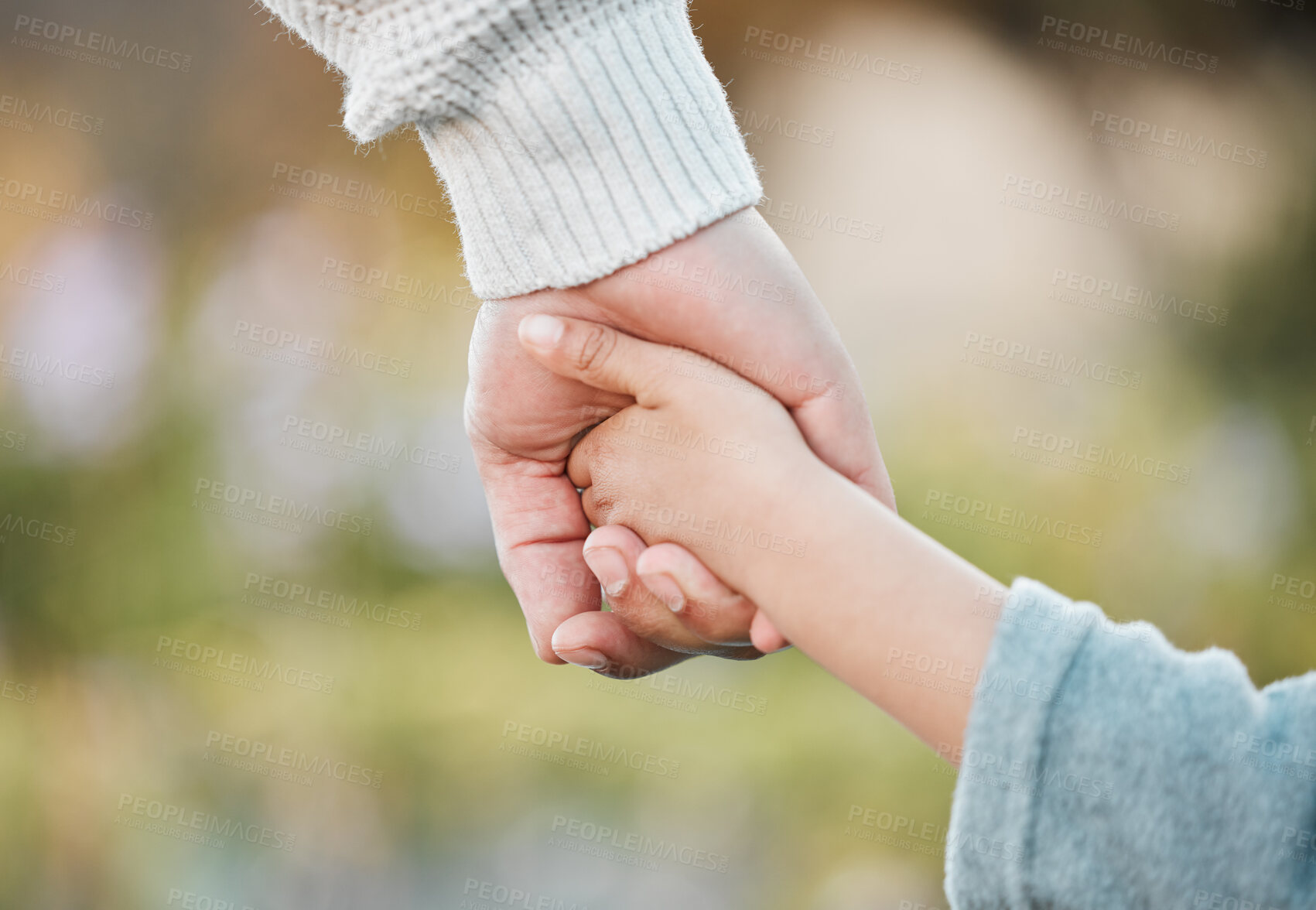 Buy stock photo Holding hands, parent and child with trust, outdoor and support in bonding as family on holiday. Person, kid and closeup, relax and care on vacation, adventure or winter getaway in nature or backyard