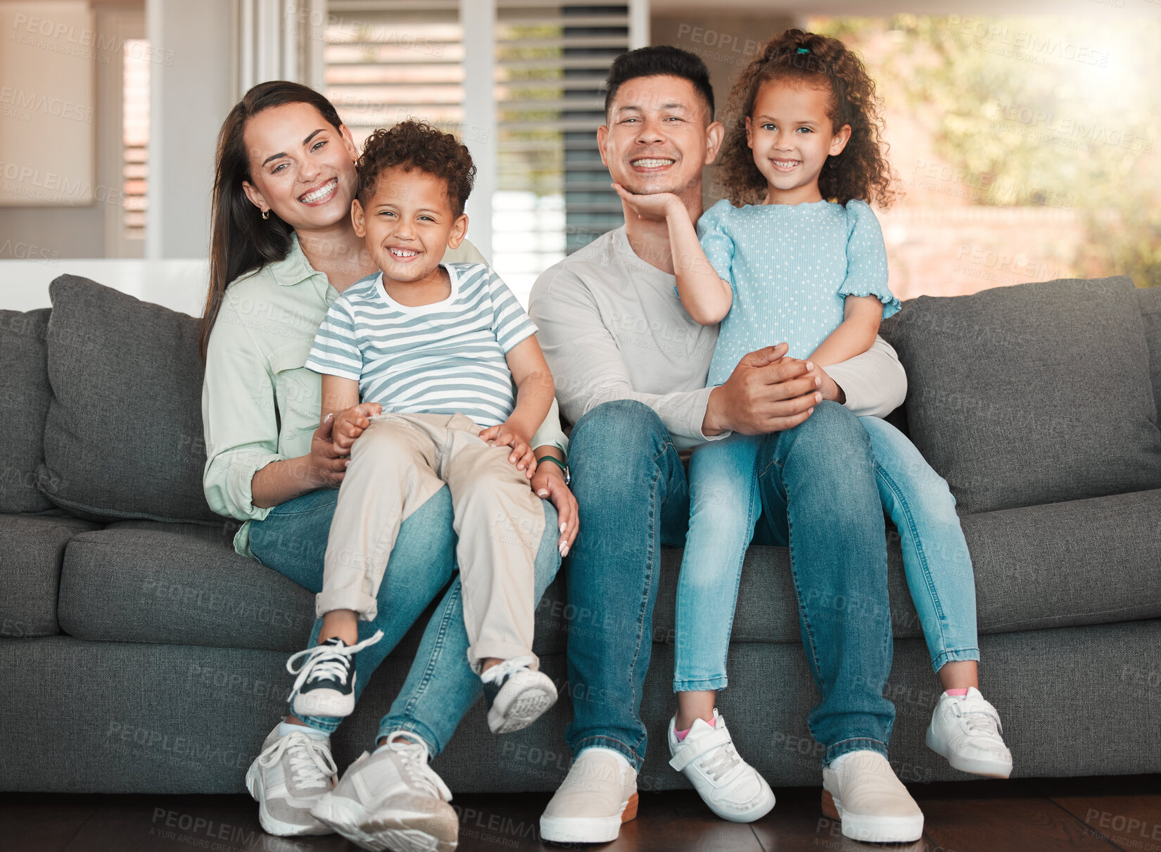 Buy stock photo Parents, happy kids and hug in home portrait, family connection and together for bonding. Mother and father, embrace children and love in Argentina, trust and care for relationship security on sofa