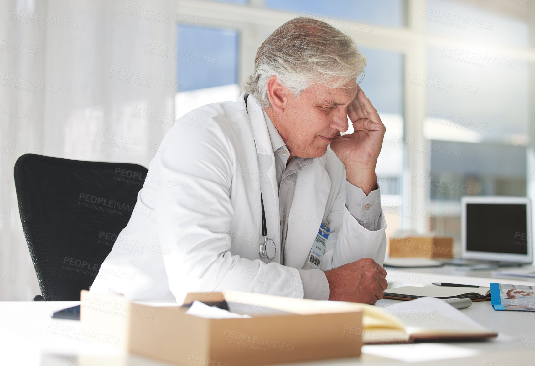 Buy stock photo Stressed man, doctor and headache from burnout, overworked or anxiety at office. Mature male medical professional, computer and eye strain for report, research and health solution issue in workplace