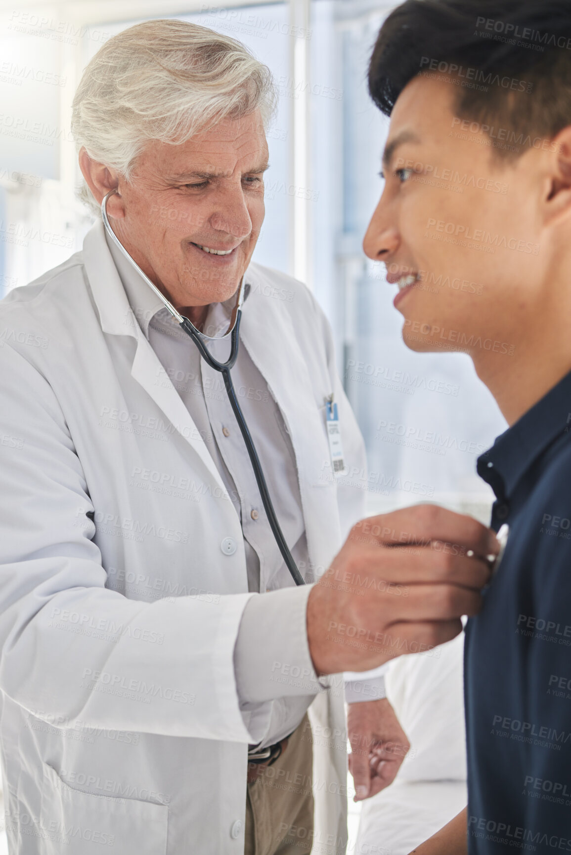 Buy stock photo Doctor, patient and stethoscope in clinic for medical examination, checkup and consultation. Mature, physician and male person with health, heart beat and breathing for care or medicine in hospital