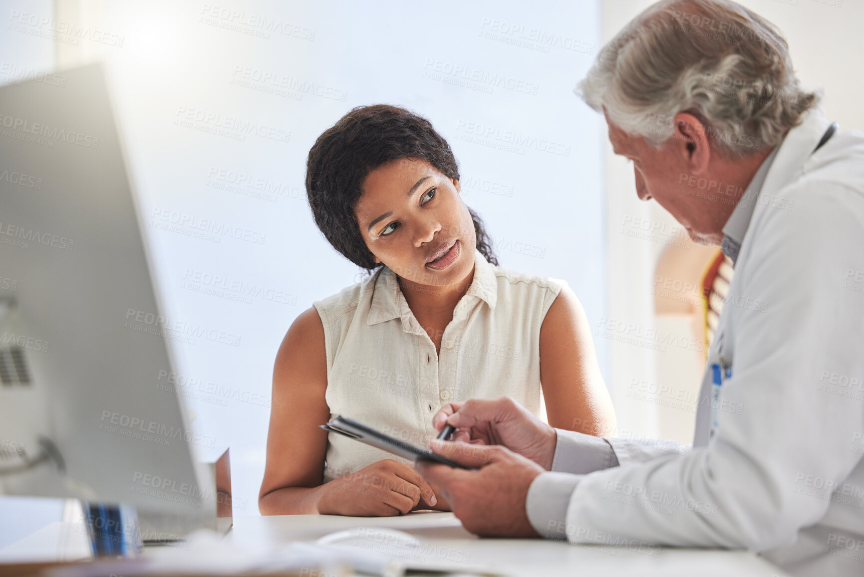 Buy stock photo Clipboard, computer and doctor talking to woman in office at hospital for appointment or consulting. Desk, insurance and medical with healthcare professional in clinic checkup to explain diagnosis