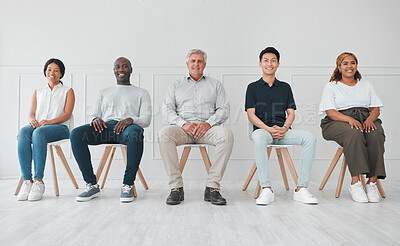 Buy stock photo Portrait of a diverse group of people sitting in line against a white background