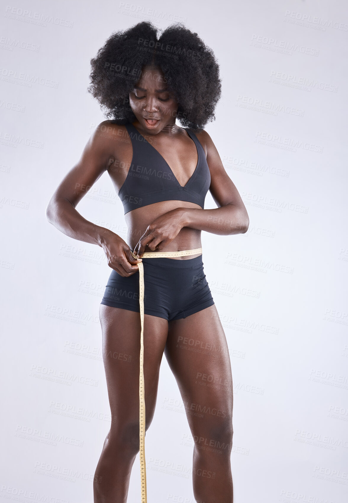 Buy stock photo Weight loss, measuring tape and black woman in studio for wellness, healthy diet or fitness with white background. Underwear, stomach and happy person for results in exercise, waist or body goals