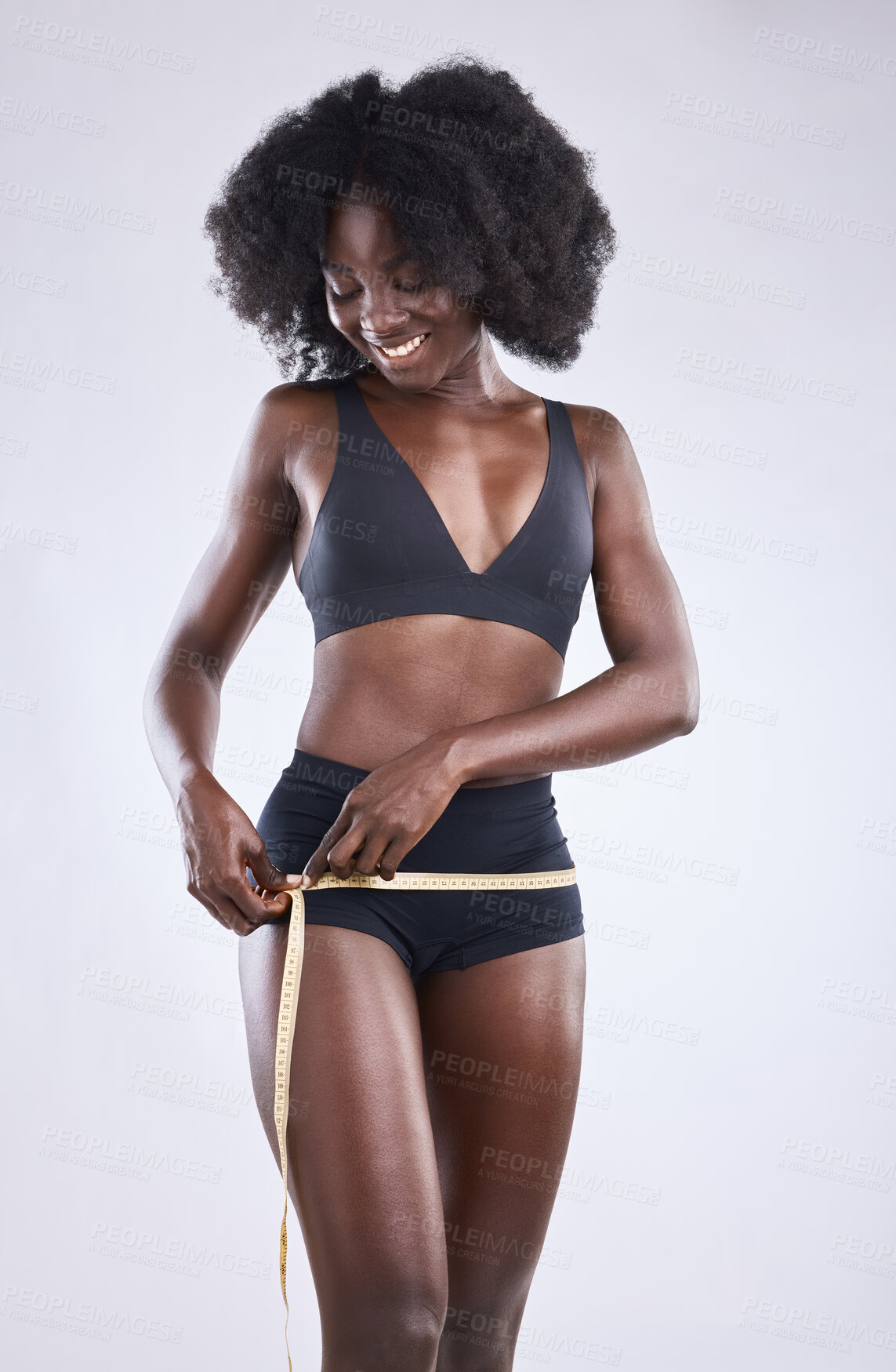 Buy stock photo Waist, tape measure and black woman in studio for wellness, healthy diet or fitness with white background. Underwear, confidence and female person for results in exercise, weight loss or body goals