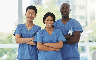 Buy stock photo Confidence, crossed arms and portrait of team of doctors standing in the hallway of hospital. Happy, diversity and group of professional medical workers with smile in collaboration at medicare clinic