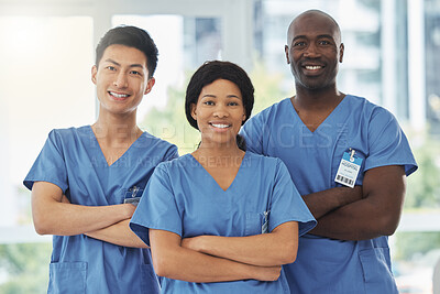 Buy stock photo Healthcare, crossed arms and portrait of doctors with confidence standing in the hospital. Happy, diversity and group of professional medical workers with a smile in collaboration at medicare clinic.