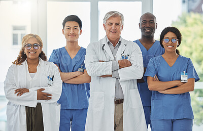 Buy stock photo Happy portrait, arms crossed and group of doctors standing together in hospital. Face, teamwork and confident medical professionals, nurses and surgeons with collaboration, healthcare and support.