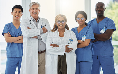Buy stock photo Leadership portrait, smile and doctors with arms crossed standing together in hospital. Face, teamwork and confident medical professionals, surgeon group and nurses with collaboration for healthcare.