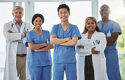 Buy stock photo Nurses, portrait and team of doctors with arms crossed standing together in hospital. Face, confident and medical professionals, group and happy surgeons in collaboration, teamwork and healthcare.